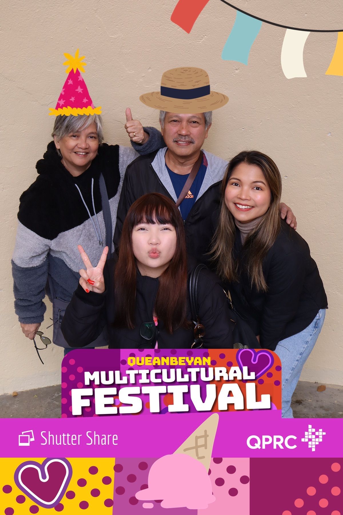 Friends enjoying the photo booth at the Multicultural Festival